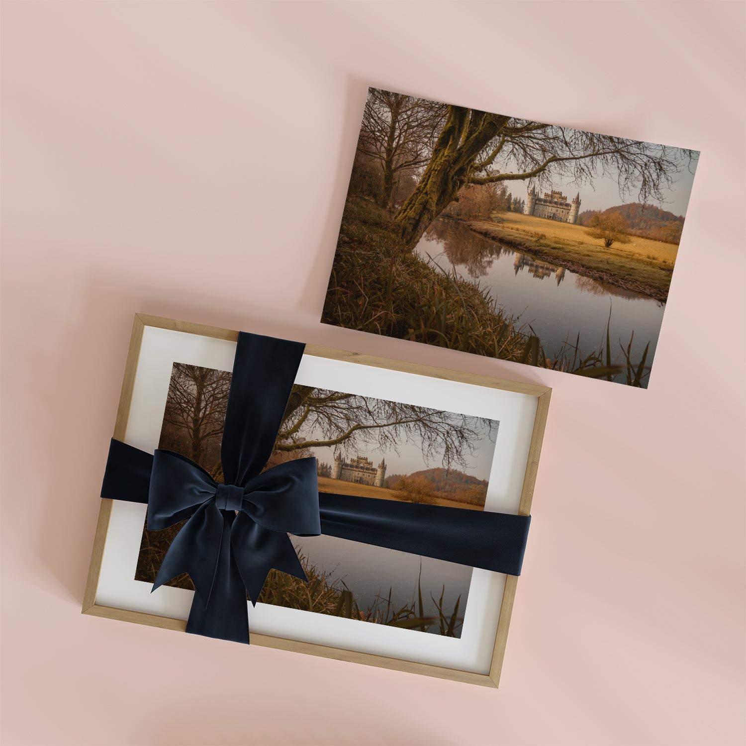 A framed Scottish landscape print shown as a Scottish wedding gift next to an unframed print.