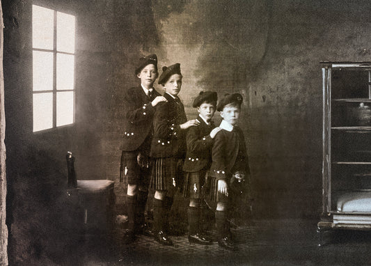 four brothers wearing traditional Scottish outfits depicting Scottish Heritage