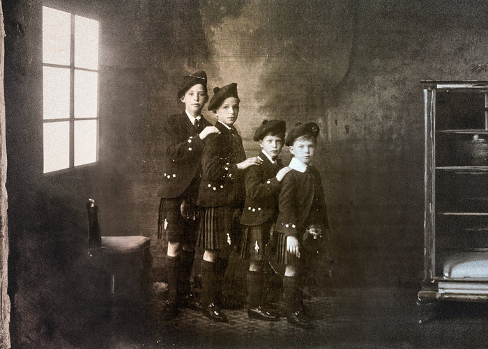 four brothers wearing traditional Scottish outfits depicting Scottish Heritage